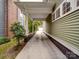 Long driveway leading to a garage, providing ample parking space and a charming outdoor walkway at 226 Union S St, Concord, NC 28025