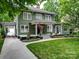 Charming two-story home with a welcoming front porch, lush landscaping, and inviting curb appeal at 226 Union S St, Concord, NC 28025