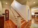 Traditional staircase with wooden steps, white risers and banister, leading to the upper level of the home at 226 Union S St, Concord, NC 28025