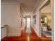 Spacious hallway featuring hardwood floors and access to various rooms, providing a sense of openness and flow at 226 Union S St, Concord, NC 28025
