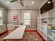 Bright home office with hardwood floors, a large white desk, and modern decor at 226 Union S St, Concord, NC 28025