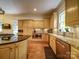 Spacious kitchen boasts granite countertops, stainless steel appliances, wood cabinets, and a large island at 226 Union S St, Concord, NC 28025