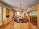 Gourmet kitchen features a large island, stainless steel appliances, and custom cabinetry at 226 Union S St, Concord, NC 28025