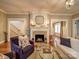 Warm and inviting living room with hardwood floors, a fireplace, and comfortable seating at 226 Union S St, Concord, NC 28025