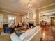 Cozy living room with hardwood floors, fireplace, comfortable seating, and abundant natural light at 226 Union S St, Concord, NC 28025