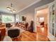 Open living room showcases hardwood floors, stylish lighting, and an open doorway to the Gathering room at 226 Union S St, Concord, NC 28025