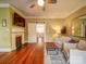 Inviting living room with fireplace, hardwood floors, and comfortable seating arrangement at 226 Union S St, Concord, NC 28025