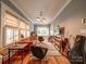 Inviting living room features hardwood floors, large windows, and a unique music-inspired decor at 226 Union S St, Concord, NC 28025