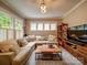 Relaxing living room with comfortable seating, a large sectional sofa, and natural light at 226 Union S St, Concord, NC 28025