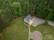 Aerial view of garage with apartment, long drive way and manicured yard at 2609 Cove Creek Dr, Gastonia, NC 28056