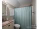 Cozy bathroom featuring a shower, vanity and mirror and modern fixtures at 2609 Cove Creek Dr, Gastonia, NC 28056