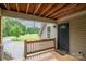 Inviting front porch with wooden deck, perfect for enjoying the outdoors at 2609 Cove Creek Dr, Gastonia, NC 28056