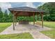 Charming gazebo with stone barbecue and swing, ideal for outdoor gatherings at 2609 Cove Creek Dr, Gastonia, NC 28056