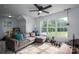 Inviting living area with large windows, comfortable seating, and plenty of natural light at 2609 Cove Creek Dr, Gastonia, NC 28056