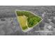 An aerial view with approximate lot lines around the property, showing wooded acreage at 2609 Cove Creek Dr, Gastonia, NC 28056