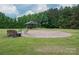 Exterior features a brick patio with a gazebo and fire pit at 2609 Cove Creek Dr, Gastonia, NC 28056