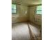 Empty bedroom with carpeted floor, needing renovation with wood trim pieces ready for installation at 2703 E Greenbriar Rd, Statesville, NC 28625