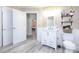 Bright bathroom featuring a white vanity, modern fixtures, and wood-look flooring at 303 Island Ford Rd, Maiden, NC 28650