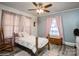 Comfortable bedroom with hardwood floors, a ceiling fan, and natural light from the windows at 303 Island Ford Rd, Maiden, NC 28650