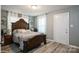Cozy bedroom features a decorative bed frame, windows, and ample natural light at 303 Island Ford Rd, Maiden, NC 28650