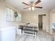 Bright dining area with a cozy booth seating, laminate floors, and a charming window at 303 Island Ford Rd, Maiden, NC 28650