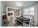 Charming dining room with a large table, built-in bench seating, and bright windows at 303 Island Ford Rd, Maiden, NC 28650