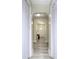 Inviting hallway features arched doorways, modern gray flooring, and fresh, neutral paint throughout at 303 Island Ford Rd, Maiden, NC 28650