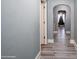 Elegant hallway featuring hardwood floors, arched doorways, and neutral paint at 303 Island Ford Rd, Maiden, NC 28650