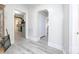 Hallway with white walls and light-colored vinyl flooring leading to the kitchen at 303 Island Ford Rd, Maiden, NC 28650