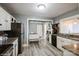 Bright kitchen with stainless steel appliances, granite countertops, and ample cabinet space at 303 Island Ford Rd, Maiden, NC 28650
