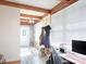 Bright office space features exposed wood beams, a brick accent wall, and a modern workstation setup at 303 Island Ford Rd, Maiden, NC 28650