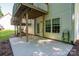 A covered patio with concrete floor, structural beams, and a second story deck above at 319 Beacon Hills Dr, Gastonia, NC 28056