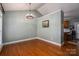 Light and airy dining room featuring hardwood floors, neutral paint and a modern chandelier at 319 Beacon Hills Dr, Gastonia, NC 28056
