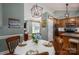 Dining room table setting with view into kitchen with stainless steel appliances and granite countertops at 319 Beacon Hills Dr, Gastonia, NC 28056
