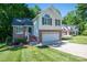 Well-kept two-story home with brick and siding, attached garage, and a neatly manicured front lawn at 319 Beacon Hills Dr, Gastonia, NC 28056