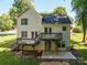 Rear exterior of the home featuring a deck and patio at 319 Beacon Hills Dr, Gastonia, NC 28056