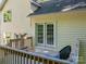 Exterior of the house with a deck, French doors, and light-colored siding at 319 Beacon Hills Dr, Gastonia, NC 28056