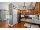 Bright kitchen with granite counters, stainless appliances and a view into the living room at 319 Beacon Hills Dr, Gastonia, NC 28056