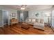 Comfortable living room with hard wood floors, a sofa, and stairs at 319 Beacon Hills Dr, Gastonia, NC 28056