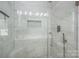 Sleek shower with glass door, built-in bench, and tiled niche at 319 Beacon Hills Dr, Gastonia, NC 28056