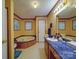 Bathroom featuring a bathtub, vanity with a sink, and neutral-colored walls, providing a clean and functional space at 3750 Turner Rd, Clover, SC 29710