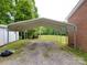 Spacious metal carport connected to a brick home and a shed, providing covered parking and storage at 3750 Turner Rd, Clover, SC 29710