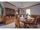 Dining room with wooden table and chairs, chandelier and lots of natural light at 3750 Turner Rd, Clover, SC 29710