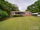 Traditional brick home with a front porch, carport and a spacious front lawn at 3750 Turner Rd, Clover, SC 29710