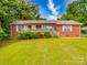 Charming brick ranch-style home featuring a covered front porch and well-maintained lawn at 3750 Turner Rd, Clover, SC 29710