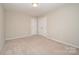 Cozy bedroom featuring neutral paint and closet doors at 4324 Falls Lake Sw Dr, Concord, NC 28025