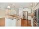 Bright kitchen with white cabinetry, stainless steel appliances, and a peninsula with seating at 4324 Falls Lake Sw Dr, Concord, NC 28025