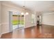 Spacious living room featuring a fireplace, sliding glass door, and hardwood floors at 4324 Falls Lake Sw Dr, Concord, NC 28025