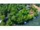 Stunning aerial view of a lakefront property with mature trees, manicured lawns and private boat dock at 4647 16Th Street Ne Pl, Hickory, NC 28601