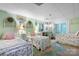 Charming bedroom with mint walls featuring three twin beds with floral comforters and cottage-core wall decor at 4647 16Th Street Ne Pl, Hickory, NC 28601